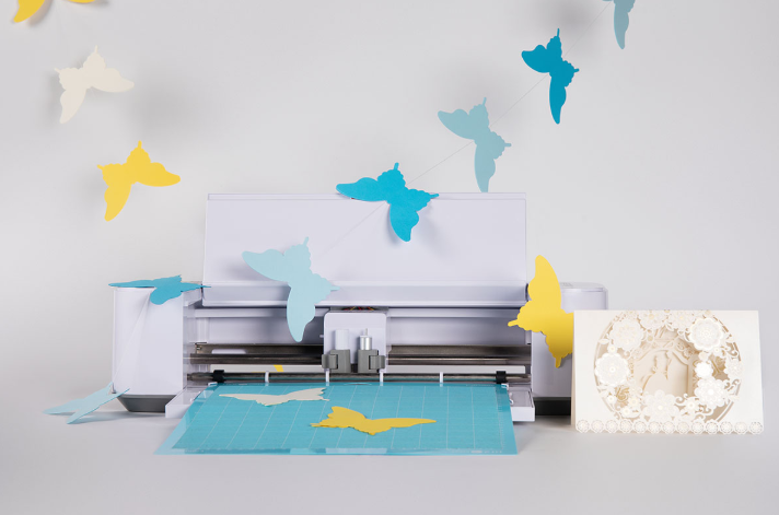 Wedding invitations being printed and prepared for delivery.